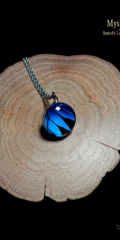 Handmade Papilio ulysses butterfly wing pendants under 18mm glass lens, bulk wholesale necklaces, nature-inspired jewelry for gift shops and boutiques