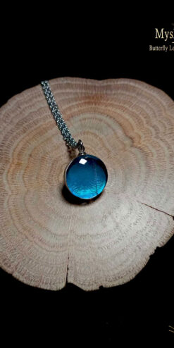 Handmade Blue Morpho butterfly wing pendant with real Morpho deidamia wing encased in 16mm glass, symbolic jewelry for transformation, peace, and good luck