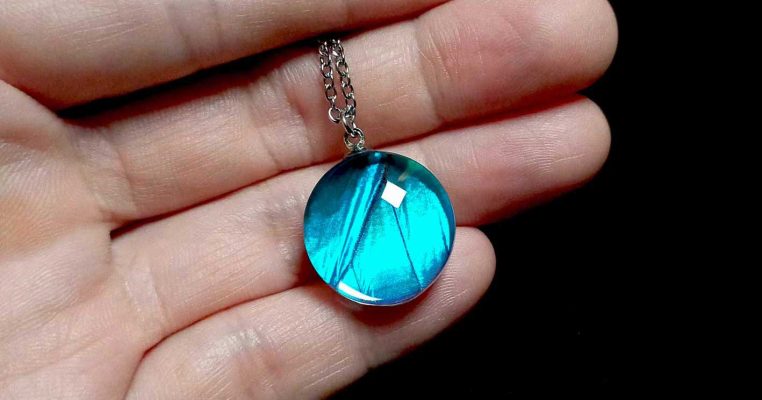 real Blue Morpho butterfly wing pendant under natural light